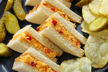 pimento cheese sandwiches with pickles and chips