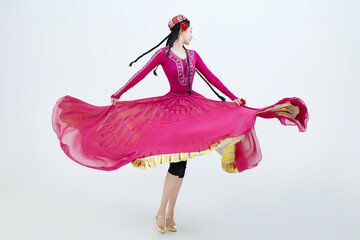 Beautiful dancers performing traditional Uyghur dance from Xinjiang, China