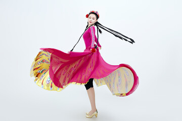 Beautiful dancers performing traditional Uyghur dance from Xinjiang, China