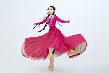 Beautiful dancers performing traditional Uyghur dance from Xinjiang, China