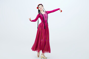 Beautiful dancers performing traditional Uyghur dance from Xinjiang, China