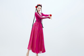 Beautiful dancers performing traditional Uyghur dance from Xinjiang, China