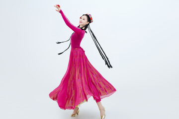 Beautiful dancers performing traditional Uyghur dance from Xinjiang, China