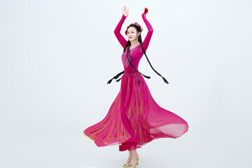 Beautiful dancers performing traditional Uyghur dance from Xinjiang, China