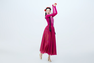 Beautiful dancers performing traditional Uyghur dance from Xinjiang, China