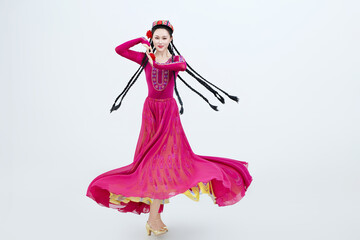 Beautiful dancers performing traditional Uyghur dance from Xinjiang, China