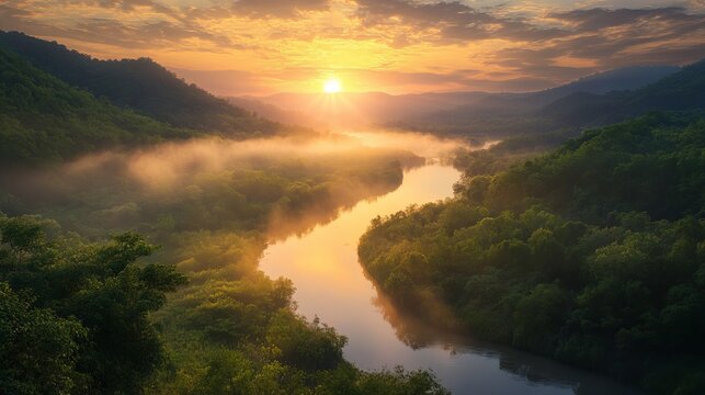 Aerial view of a river winding through a lush green valley at sunrise with a cloudy sky above it