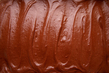 Close Up Top View of Handmade Melted Chocolate Brownie Mixture Background