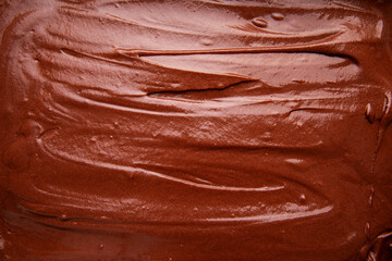 Close Up Top View of Handmade Melted Chocolate Brownie Mixture Background