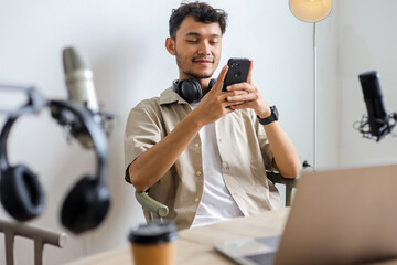 Young Asian Vlogger Live Recording, Checking Likes Comment or Chatting on Social Media Using Phone