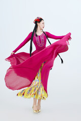 Beautiful dancers performing traditional Uyghur dance from Xinjiang, China
