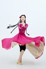 Beautiful dancers performing traditional Uyghur dance from Xinjiang, China