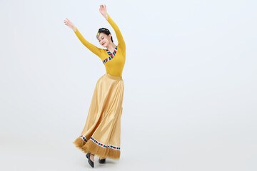 Beautiful dancers performing traditional Tibetan Guozhuang dance in Tibet, China