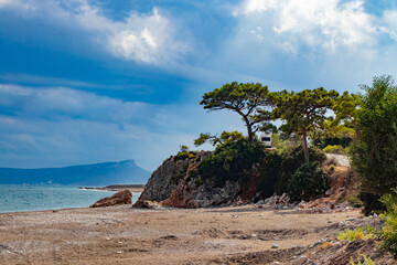 beautiful natural landscape with rocks, stones and fir trees directly at the sea in Kemer Turkey