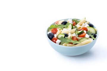 Mediterranean Pasta Salad in bowl with Fresh Vegetables and Herbs isolated on white background. Copy space