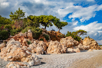 beautiful rocky landscape overgrown with beautiful plants and trees in Kemer Turkey