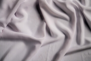 Elegant Draped White Fabric with Smooth Silky Texture