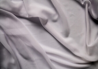 Elegant Draped White Fabric with Smooth Silky Texture