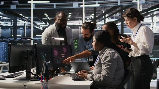 Angry technicians in server room fighting each other after encountering critical error popup during maintenance. Engineers having tense conversation, doing system recovery brainstorming chat, camera A