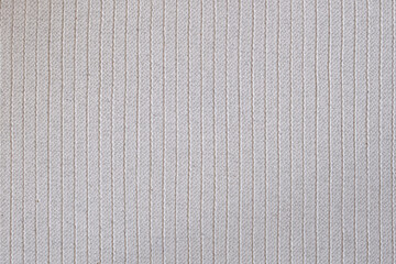 Close-up of white ribbed rubber mat surface with vertical linear texture. Studio macro texture...