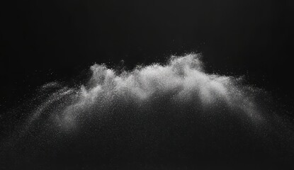 White powder cloud against black background