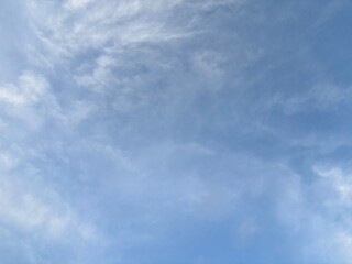 Fototapeta premium clean bright blue sky background with beautiful clean white clouds, creative natural background