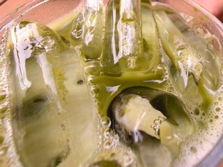 Refreshing Green Drink with Ice Cubes Close-up