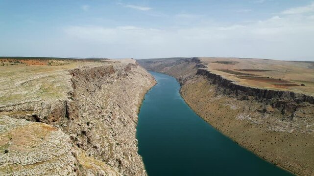 Aerial View of Ancient Settlement Remains along the Euphrates River with Surrounding Canyons &ndash; Hidden Archaeological Site in Southeastern Turkey