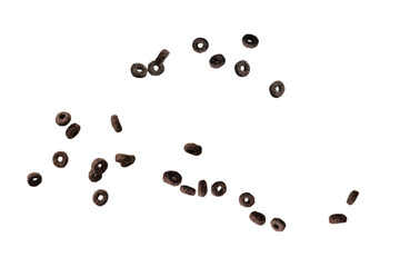 Chocolate rings cereal spill out into a bowl. Breakfast.