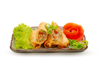 Delicious fried spring rolls with fresh vegetables on a stylish ceramic plate on transparent.