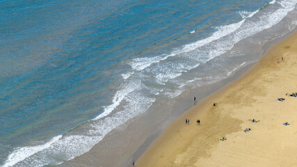Aerial view of people on the beach of Serapo located in Gaeta, province of Latina, Lazio, Italy. Holiday at sea concept.