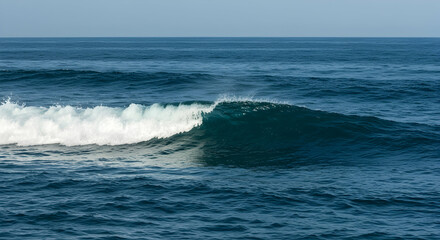Fototapeta premium Calm Ocean Waves with Clear Blue Water Reflecting the Sky