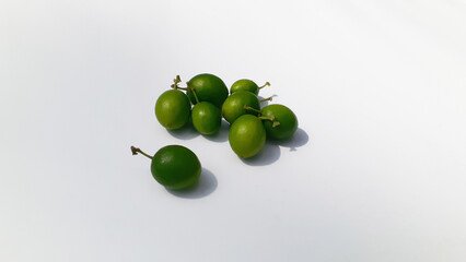 Bidara (Ziziphus mauritiana) fruit on a white background. Also known as widara, Indian jujube, Indian plum, Chinese date, Chinese apple, ber and dunks. Nature concept.
