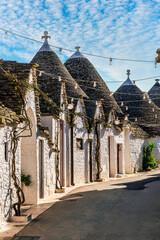 beautiful pretty vintahe houses with blue cloudy sky on background. old mediterranean home for...