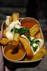 Triple cooked chips and dips street food at a food market