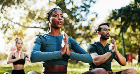 Breathing, meditation and yoga with people in park for holistic exercise or wellness routine. Awareness, balance and prayer hands with yogi group outdoor in nature for fitness, mindfulness or namaste