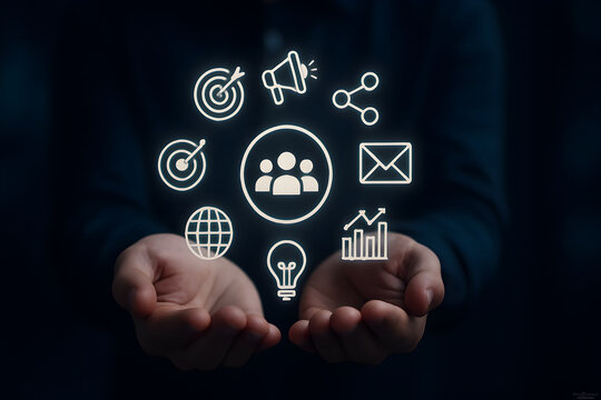 Digital marketing and target audience concept. Business professional holding digital interface with icons representing audience targeting, advertising, SEO, social media, online marketing strategies,