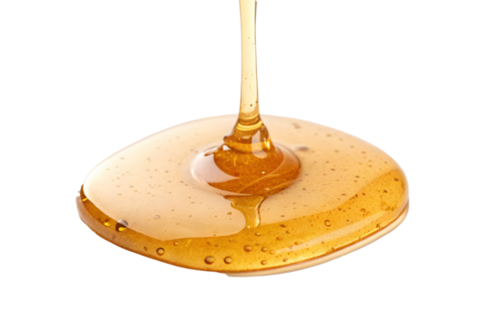 Delicious and viscous honey being poured creating an inviting and golden liquid transparent background