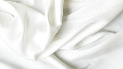 Shiny white silk background with luxury folds and flowing shapes