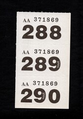 Raffle tickets isolated on a black background.