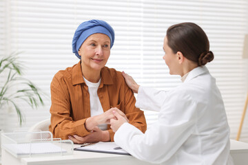 Senior woman with cancer visiting oncologist in clinic