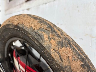 Dirty Motorcycle Tire with Sand and Dust