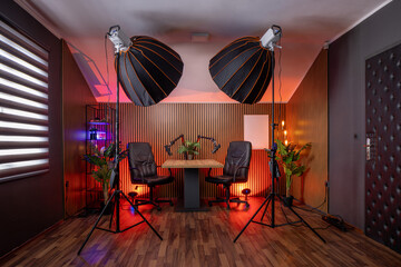 Modern podcast recording studio with professional lighting