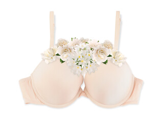 Beautiful beige bra with different flowers on white background, top view