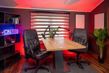 Modern podcast recording studio with professional lighting