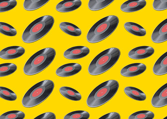 Pattern of vinyl records on yellow background