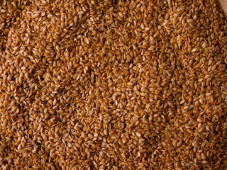 Organic golden flaxseed, linseed grains. Superfood high in fiber.