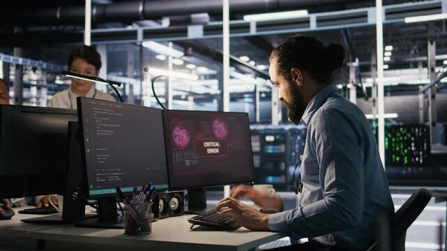 Engineer in server hub dealing with unexpected system error alert, showing signs of fatigue and irritation. Data center IT professional attempt multiple fixes after repeated failure warnings, camera A