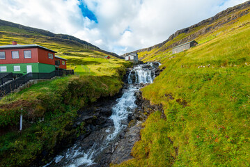 Waterfall in Town of Haldarsvik - Faroe Islands