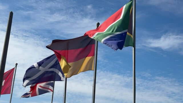 Various flags of different countries around the world at a golf course in Cape Town, South Africa.